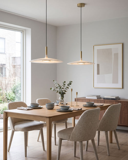 Thea Minimalist Pendant Light lit in a room setting
